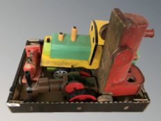 A box containing wooden nursery toys, model train.