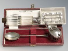 A group of silver objects to include crystal double scent bottle, belt buckle,