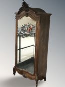 A French walnut mirror door armoire, 110 cm W x 245 cm H.
