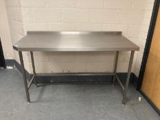 A stainless steel preparation table, width 160 cm.