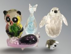 A group of decorative glass ornaments,