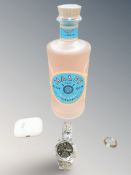 A pair of Apple Airbuds, together with a Gent's stainless steel Tissot wristwatch,