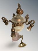 A copper effect glass lamp together with wall light