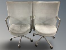 A pair of Danish Erik Jorgensen designed 'Partner' chrome-framed executive swivel armchairs,