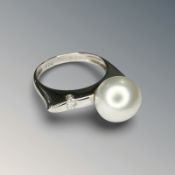 An 18ct gold pearl and diamond ring,