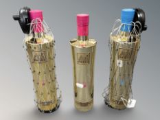 Two bottles of Au vodka pink lemon and a further Au vodka blue raspberry.