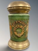 A vintage ceramic tobacco container with brass lid (af), height 35 cm.