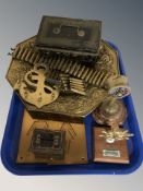 A group of brass and metal wares including door signs, nautical key stand, shell cartridges,