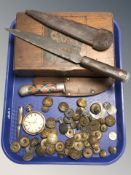 Two knives in sheathes, a quantity of military buttons, fantasy coins, etc.