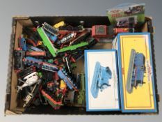 A box containing model vehicles, Thomas the Tank Engine, trains, locomotive related toys, etc.