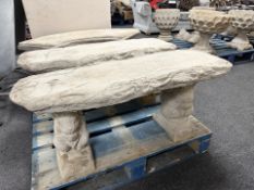 A concrete squirrel pedestal bench.