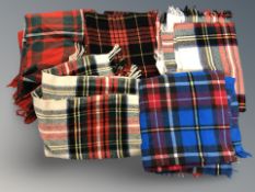 A quantity of wool tartan picnic blankets.