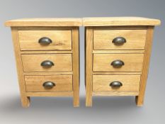 A pair of light oak three drawer bedside chests, 42 cm W x 56 cm H.