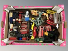A box containing die cast model vehicles, plastic aircraft, die cast buses, Days Gone, etc.