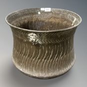 A large brass planter,