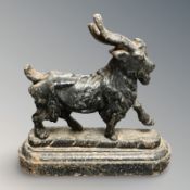 An antique iron paperweight modelled as a goat, height 14 cm.