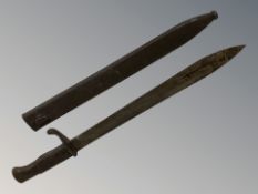 A German Second World War butcher bayonet by Deutsche Maschinenfabrik, blade 36 cm, in scabbard.