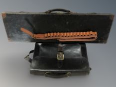 A brown leather satchel together with cartridge belt and leather gun case