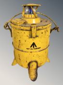 A vintage yellow railway lamp.