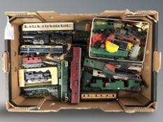 A quantity of die cast locomotives, carriages and other rolling stock.