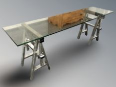 A chrome and glass topped rectangular work bench table, 200 cm x 50 cm x 66 cm.