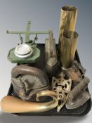 Two inert brass shells, trivet, scales,