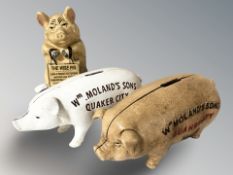 Three cast iron pig money banks, tallest 16 cm.
