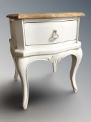 A French style painted serpentine front bedside cabinet, width 45 cm.