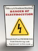 A cast iron warning plaque, 29 cm x 20 cm.