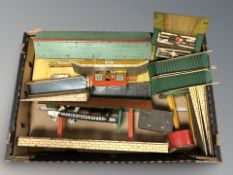 A group of tin plate model railway building models.