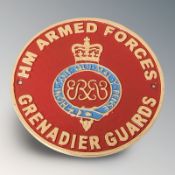 A cast iron grenadier guards plaque, diameter 24 cm.