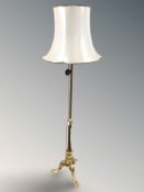 An ornate gilt metal standard lamp.