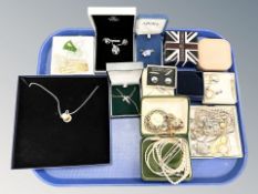 A group of costume jewellery, chains, rings,