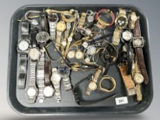 A large quantity of lady's and gent's wristwatches including Casio, Accurist, Slazenger, etc.