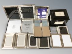 A group of decorative silver plated photo frames.