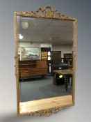 An early 20th century gilt plaster bevelled mirror, 85 cm x 52 cm.