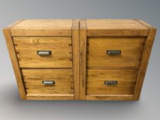 A pair of modern oak two drawer chests,