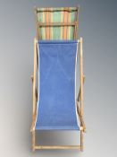Two vintage teak framed deck chairs.
