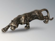 A bronzed metal figure of a panther, length 40 cm.