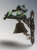 A cast iron duck wall bell on bracket, height 34 cm.