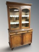 A Victorian scumbled pine bookcase,