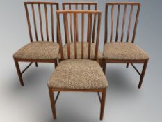 A set of four teak dining chairs