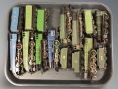 A group of die cast locomotives and tenders.