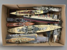 A quantity of scale model battleships and passenger ships.