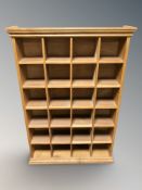 An oak CD shelf, 73 cm x 18 cm x 107 cm.