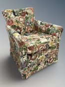 A 20th century armchair in floral upholstery,