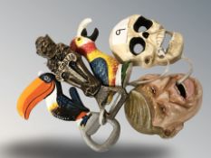 Five cast iron novelty bottle cap openers including Guinness toucan, Donald Trump, skeleton, etc.