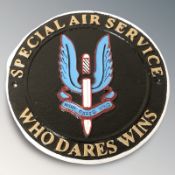 A cast iron SAS plaque, diameter 25 cm.