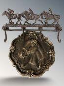 Two horse themed cast iron coat racks, largest 40 cm wide.