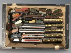 A quantity of die cast locomotives, carriages and other rolling stock.